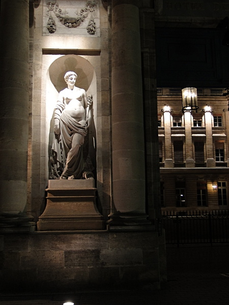 Victorian Statue in a European City at Night