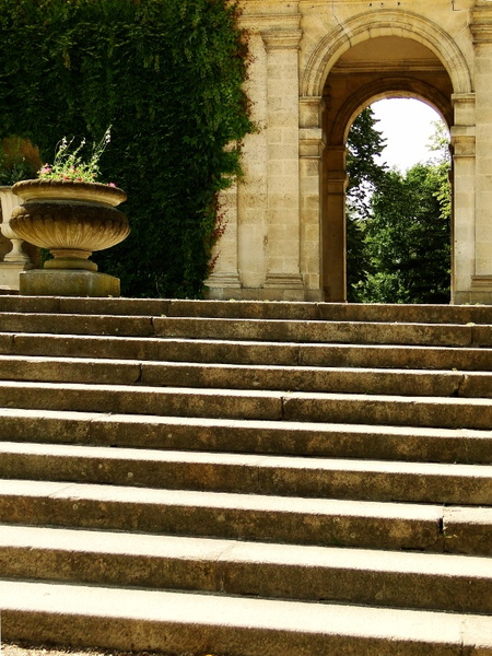Serene French Garden Entrance with Stone Steps