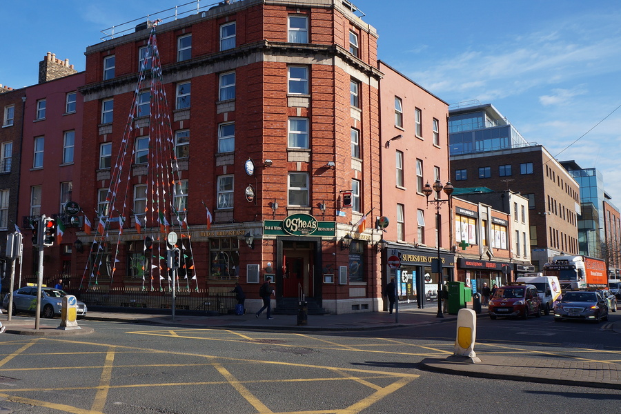 Dublin Street Scene with Red Brick Buildings and Festive Decorations