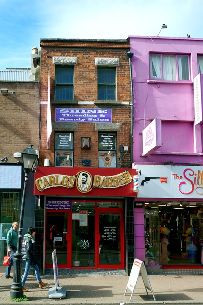 Vibrant Urban Street Scene with Colorful Storefronts