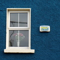 Blue Wall with Sign and Open Window