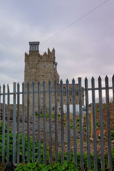 Historic Tower and Church Surrounded by Fence