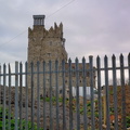 Historic Tower and Church Surrounded by Fence