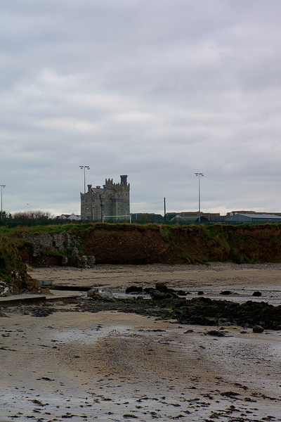 Desolate Shore with Abandoned Structure