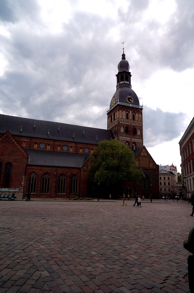 Historic Riga Church Amidst Stormy Skies