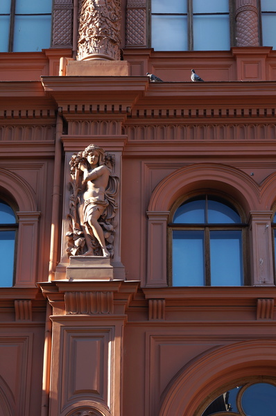 Historic Building Facade with Statue and Windows