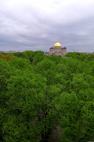 A serene day in Riga: A view from above overlooking a park and a cathedral.