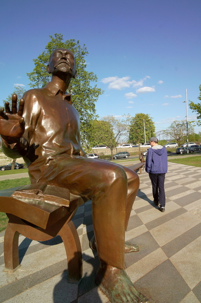 A Sculpture of a Person in an Outdoor Park