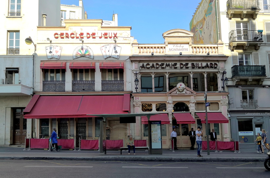 Vibrant Parisian Street Corner with a Cafeteria and Advertisement