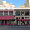 Vibrant Parisian Street Corner with a Cafeteria and Advertisement