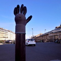 A Metal Hand Statue in a Parisian Street