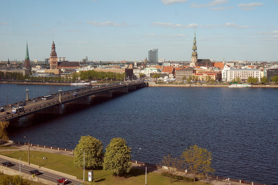 Serene Scenic View of Riga, Latvia - Bridge Over a Calm River in a Cityscape