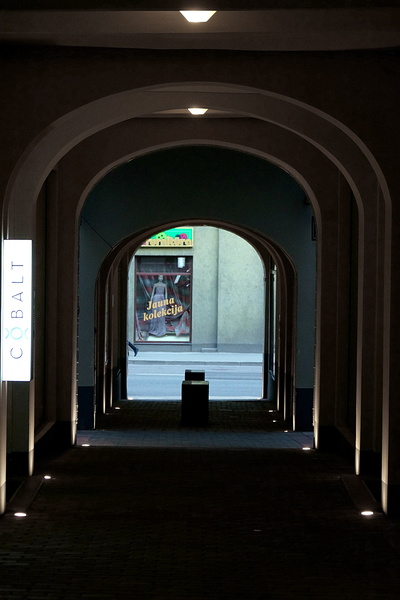 Architectural Perspective: A Narrow Corner Through an Archway