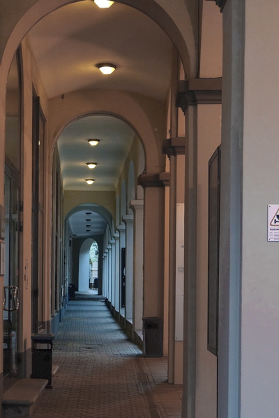 Empty Corridor with Arched Walkway