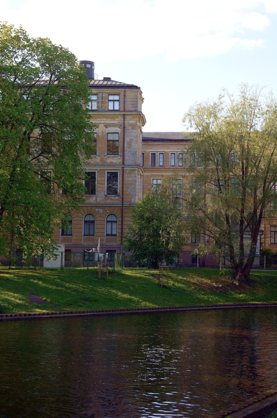 Historic European Building with Reflection on Water in Riga, Latvia