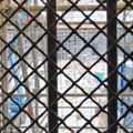 Construction Scene Viewed from Behind Bars