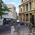 Urban Scene: A Woman Walks Past a Church in Paris, France