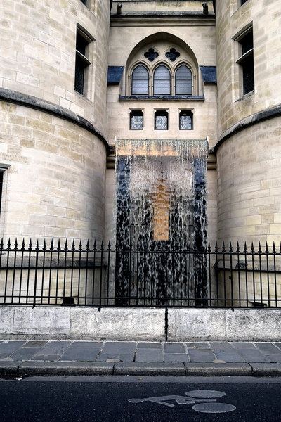 A Historic Building Entrance with a Water Feature