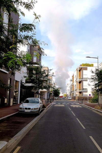 Smoke Rising from a Residential Street in Paris, France