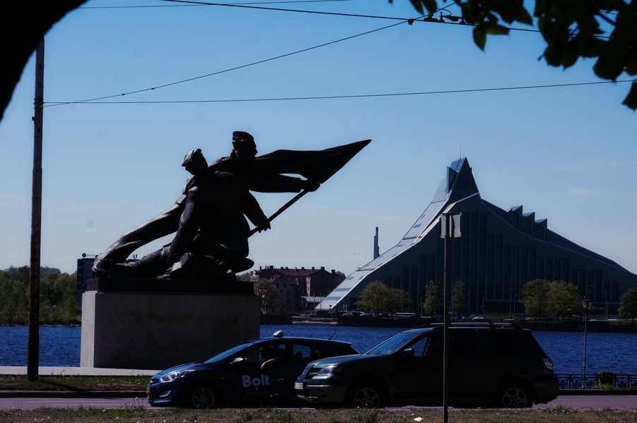 Riga City Landmark with Flag and Modern Vehicles