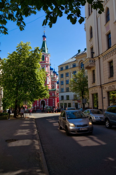 Riga Street: A European Scene with Historic Architecture and Modern Vehicles
