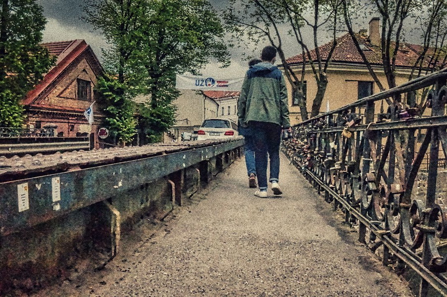 A Lone Figure on a Bridge