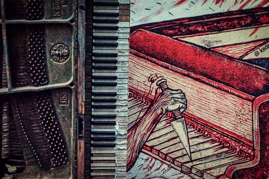 Vintage Musical Keys on Wall with Painted Piano in Background