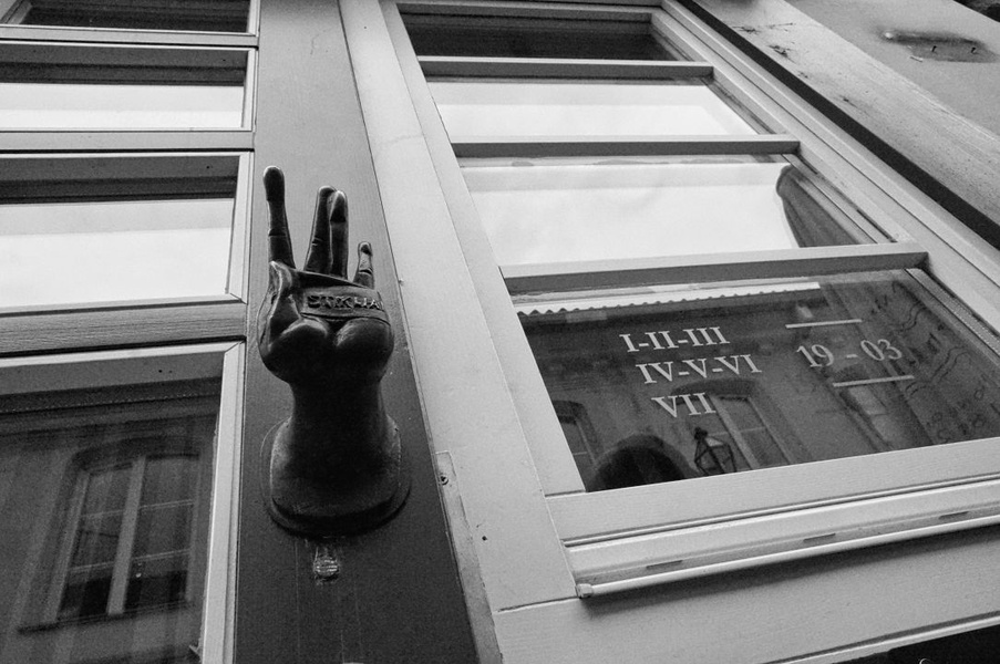 Hand Statue in Window of Vilnius Building