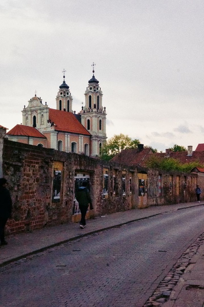 Narrow European Street Leading to a Historic Church