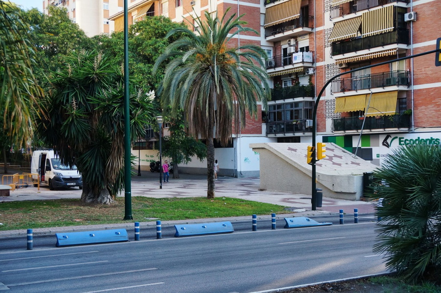 City Street Scene with Bollards and Palm Trees