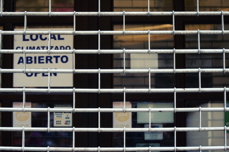 A Closed Storefront Behind Metal Bars