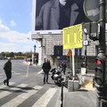 Bustling City Life: A Billboard Adjacent to a Bus Stop on a Rainy Day
