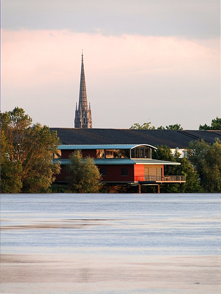 Serene Church on the Shore of a Calm Lake at Dusk