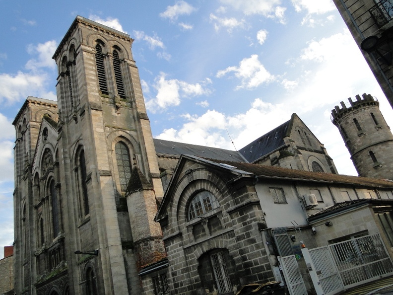 The image depicts an old, abandoned Gothic church with prominent steeples. The building shows signs of decay and disrepair, indicating that it has been neglected for some time. Despite the state of disarray, the intricate architectural details typical of Gothic styles are still visible. The location is in Bordeaux, France, which suggests this church may hold historical or cultural significance to the region. DSC00600.JPG