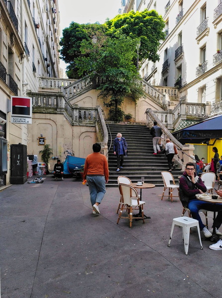 A Parisian Café Scene with Street Food Stalls and Urban Architecture