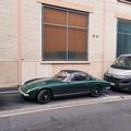 A Classic Car Parked on the Side of a European Street