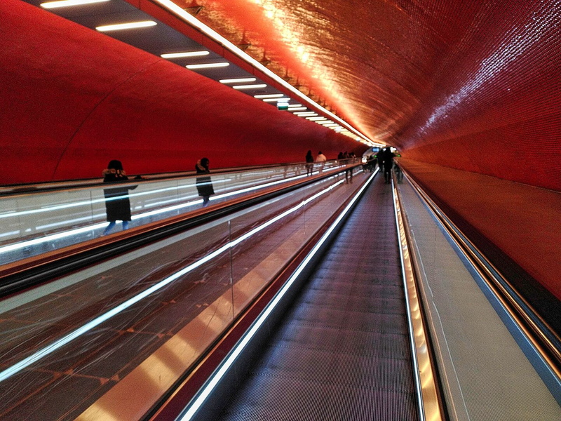 Elevated Moving Walkway in a Modern Train Station
