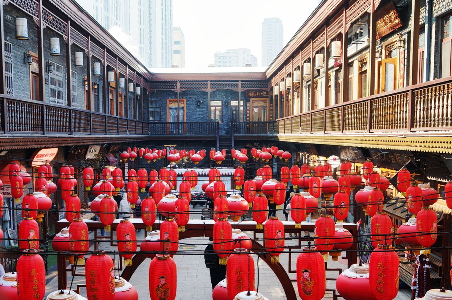 Vibrant Chinese Market Festival with Red Lanterns and Banners