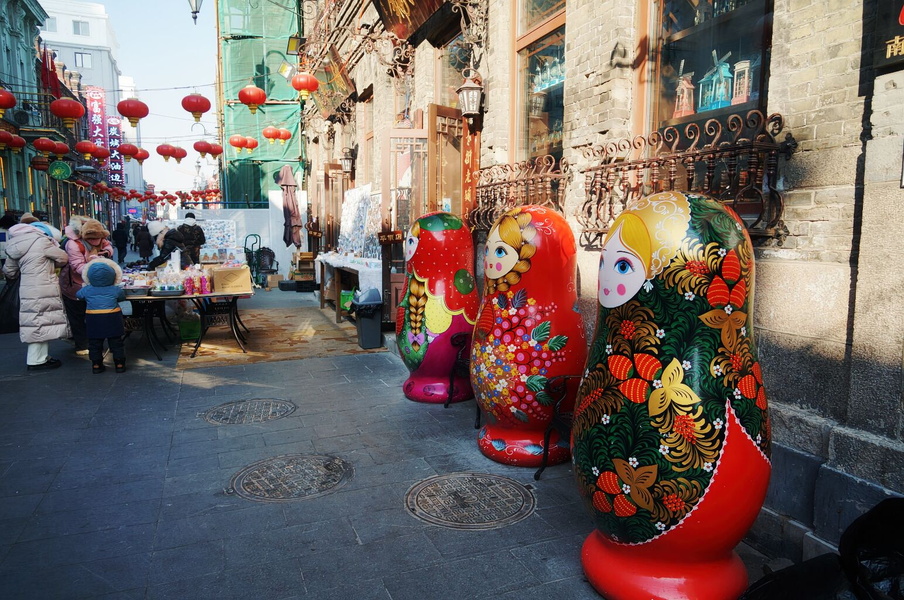 Vibrant Harbin Ice and Snow Sculpture Festival: Russian Doll Art Installation on the Street