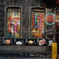 Vibrant Harbin Restaurant Display with Neon Signs and Colorful Menu Board