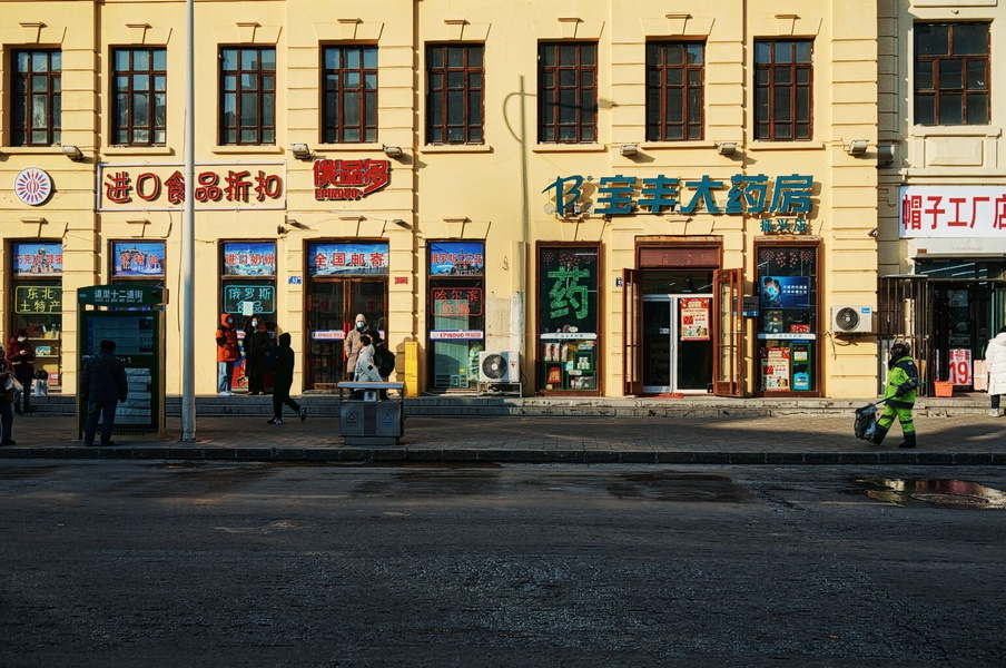 Urban Street Scene in China with Storefronts and People