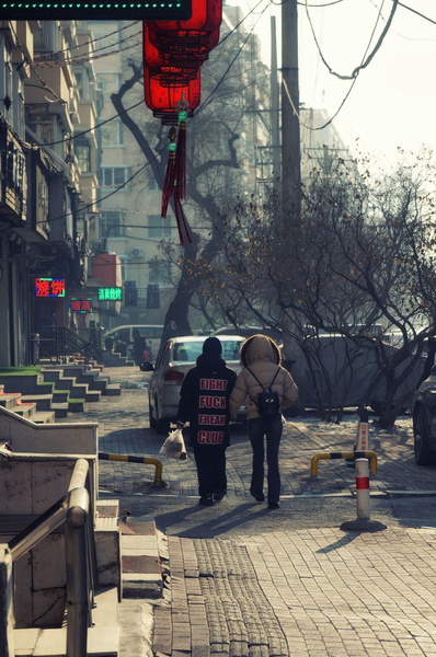 A Stroll in Harbin, China - A Couple Walks Together Amidst the City's Daily Life