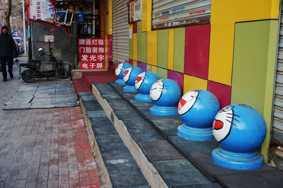 Blue Hello Kitty Urinals on City Sidewalk