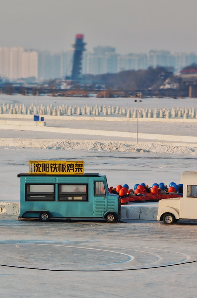 Winter Fun in Harbin, China: An Ice Rink Vendor Truck Scene