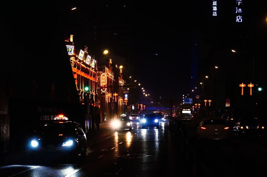 Harbin, China at Night: Rain Soaks the Streets