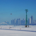 Harbin Winter Scene: City Skyline with a River and Ski Lift