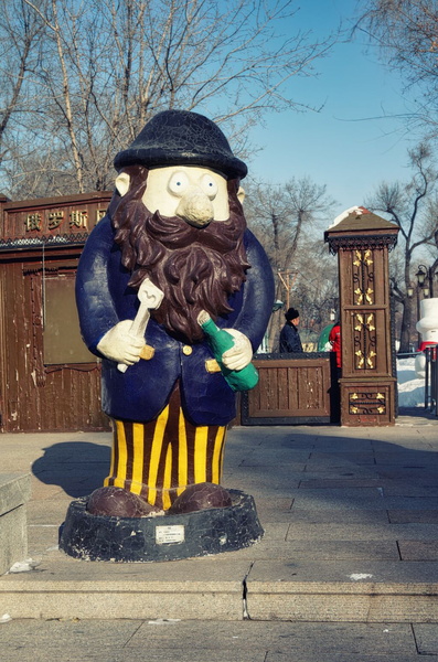 Bearded Statue in Winter Cityscape