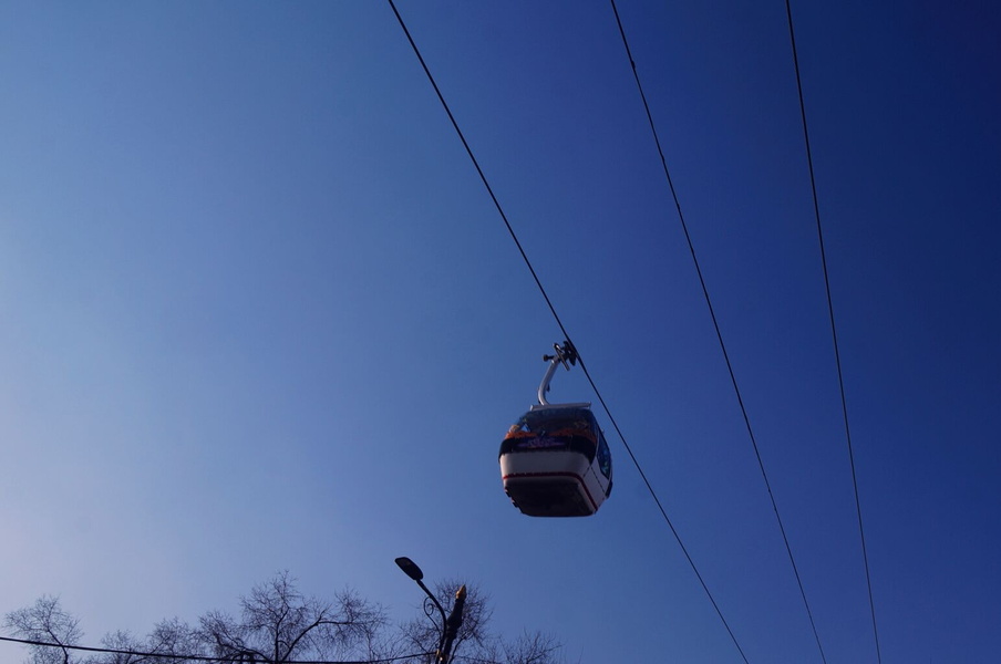 Aerial Ski Lift with Solar Panels in a Sunny Sky