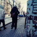 A Winter Day in Harbin, China: People Walking Amidst the Cold and Snow
