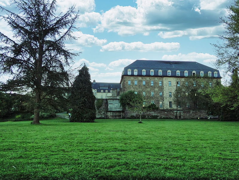 Serene Landscape: A Brick Building Amidst a Park